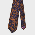 Tumbling Woven Geometrics on Natte Silk Tie in Blue, Claret & Gold