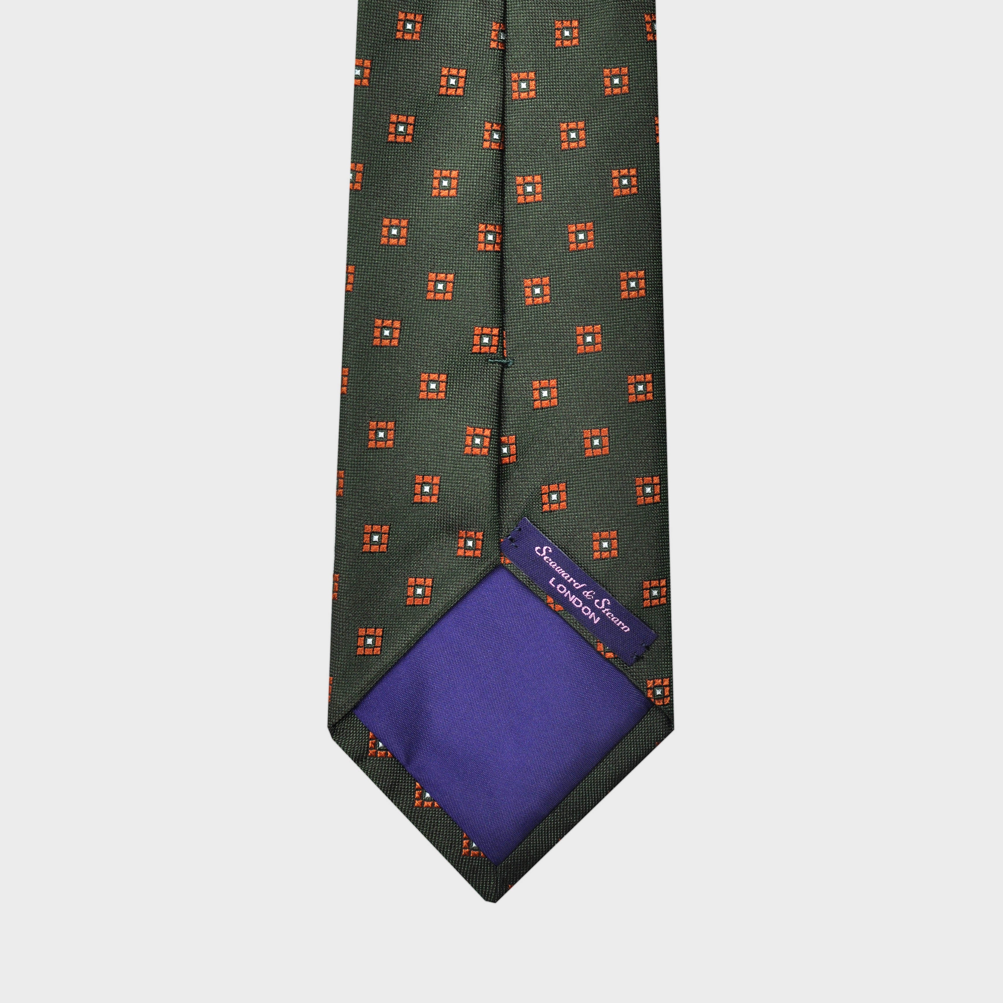 Little Repeat Orange Woven Florets on a Reppe Silk Tie in Bottle Green