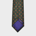 Little Repeat Orange Woven Florets on a Reppe Silk Tie in Bottle Green